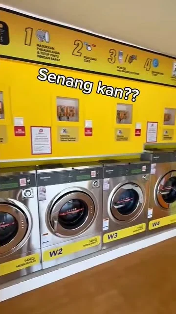 Frame from Byte Bunny's own washer film: a row of self-service washers under the caption Senang kan??